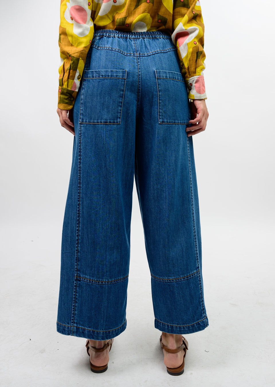 Back view of Maxine Barrel Jean in blue denim featuring an elastic waist and large patch pockets.