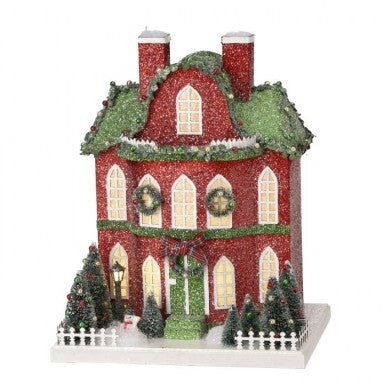 Cardboard village manor house with LED lights inside