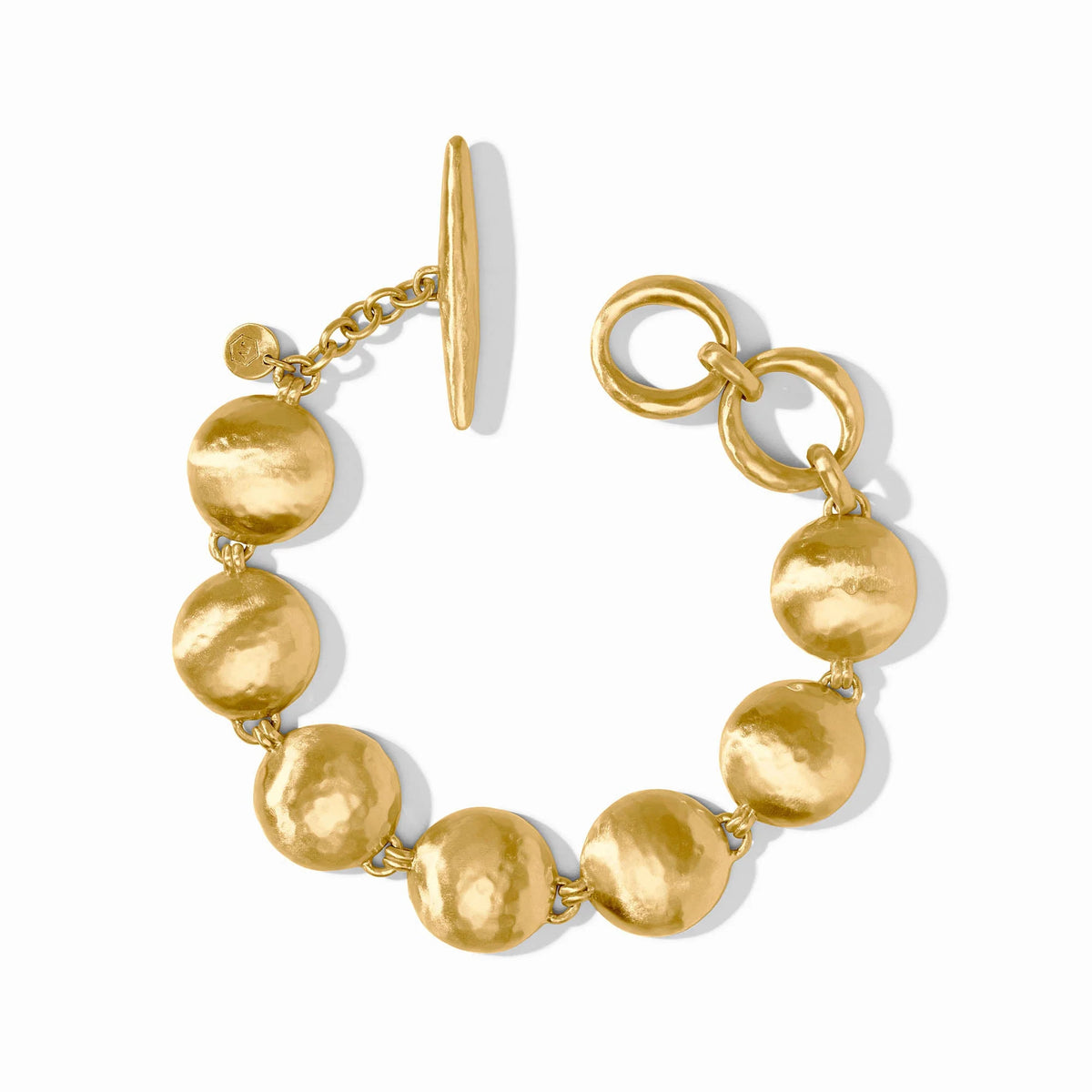 Solara gold-plated bracelet with hammered circular links and a toggle closure.