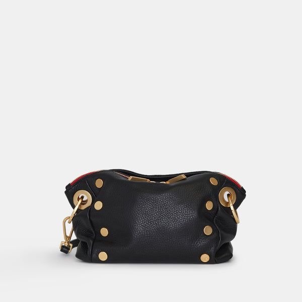 Black pebbled leather Daniel crossbody clutch with red suede lining, gold hardware, and removable strap.