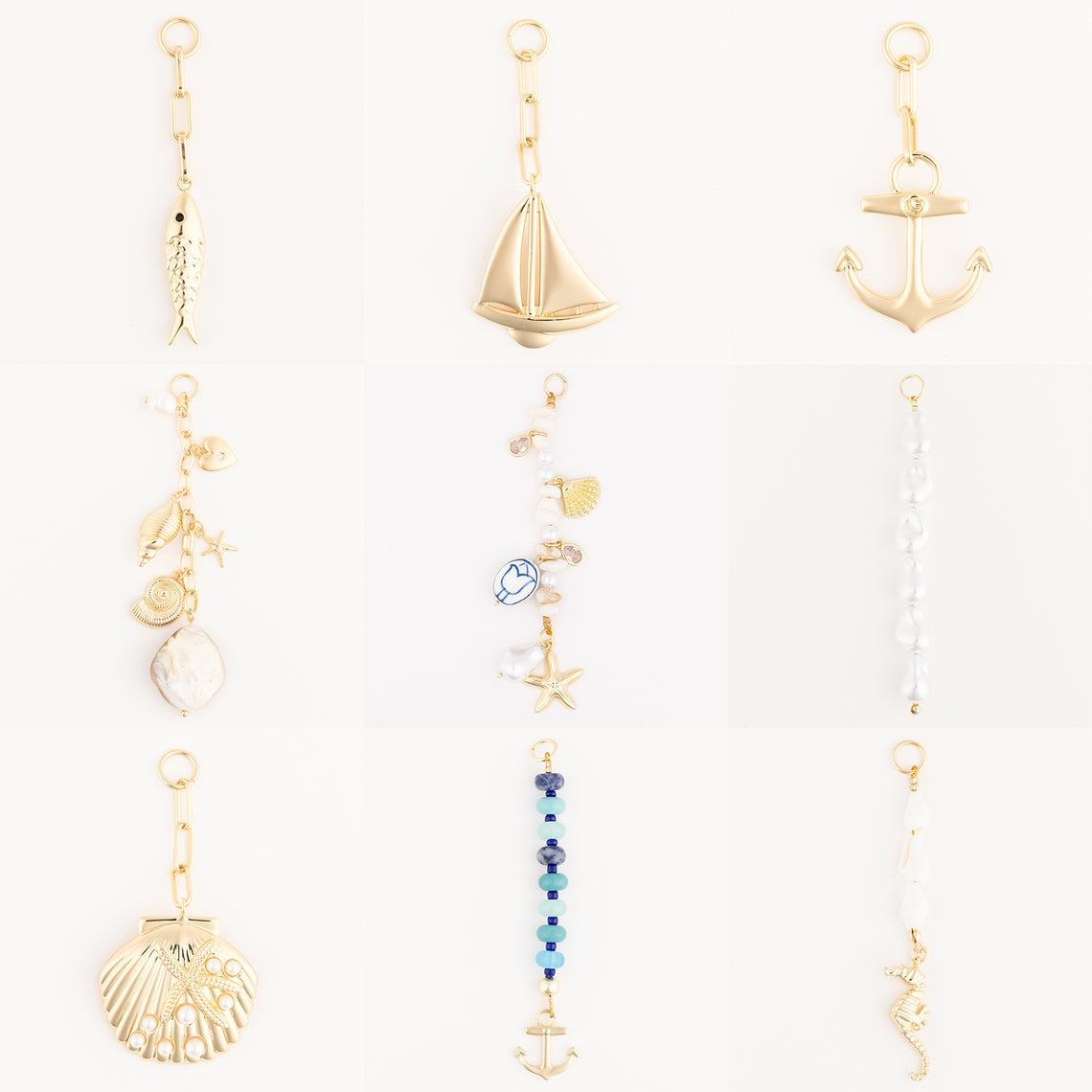 Tropical bag charm with gold-plated finish featuring leaf motifs.