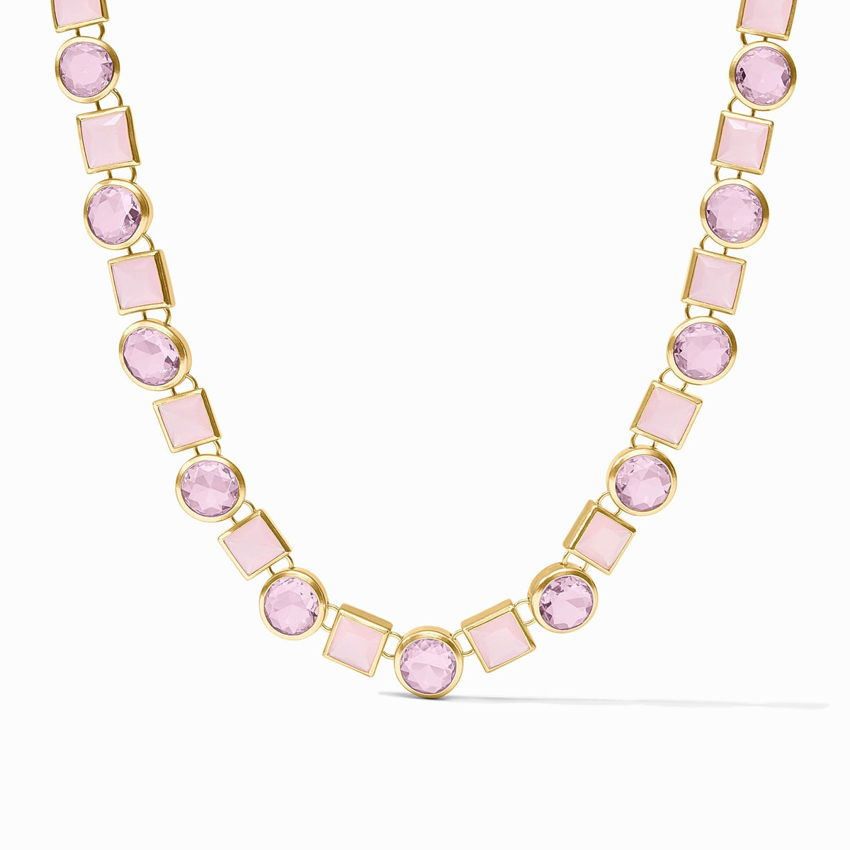 Adjustable tennis necklace with toggle clasp in gold plate finish featuring imported glass stones.