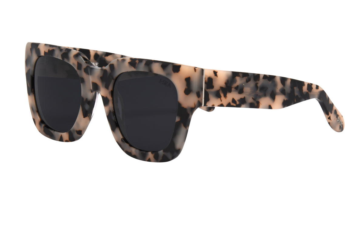 Jolene sunglasses in snow tortoise frames with smoke polarized lenses.