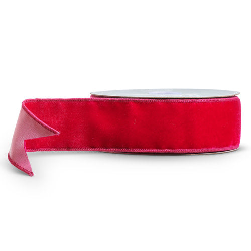 A roll of fuchsia pink velvet ribbon on a spool, 2.5 inches wide and 10 yards long.