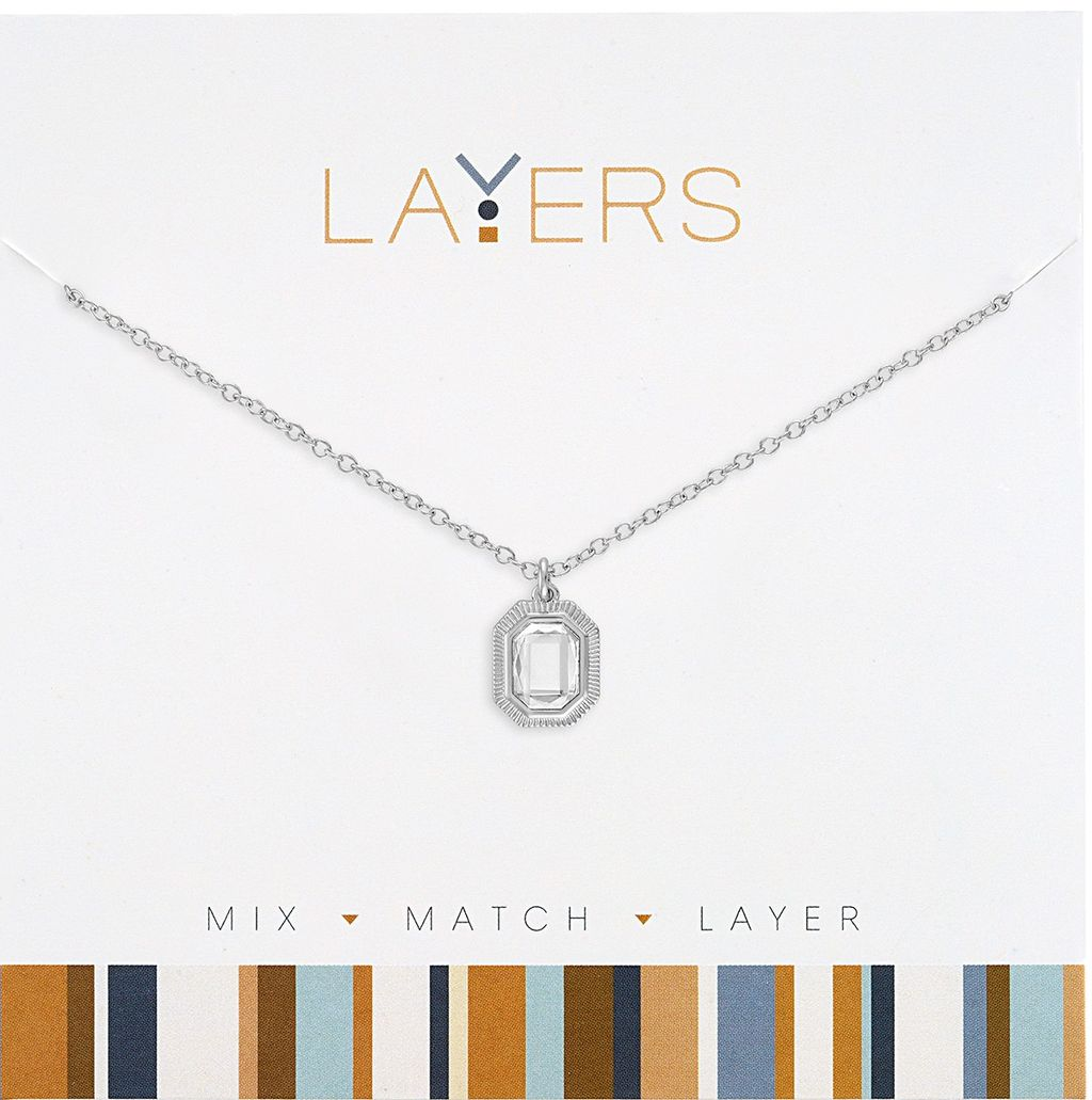 Silver necklace with an emerald-cut cubic zirconia pendant on a white display card.