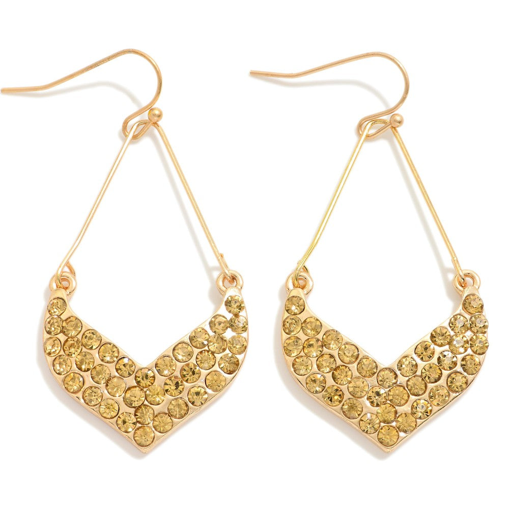 Gold-tone chevron teardrop earrings with yellow rhinestone studs and fishhook backs.
