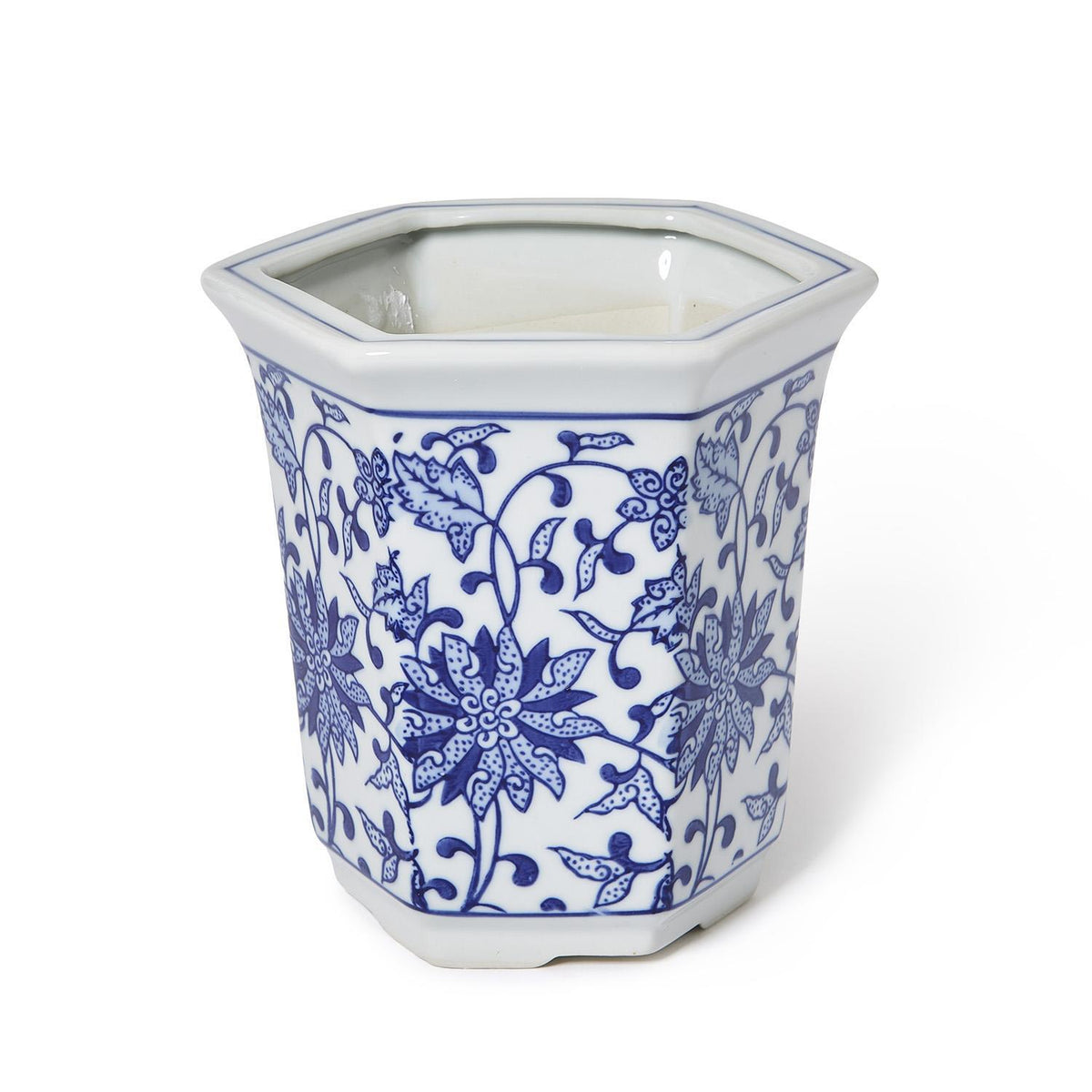 Hand-painted blue and white ceramic hexagon cachepot with intricate floral chinoiserie patterns.
