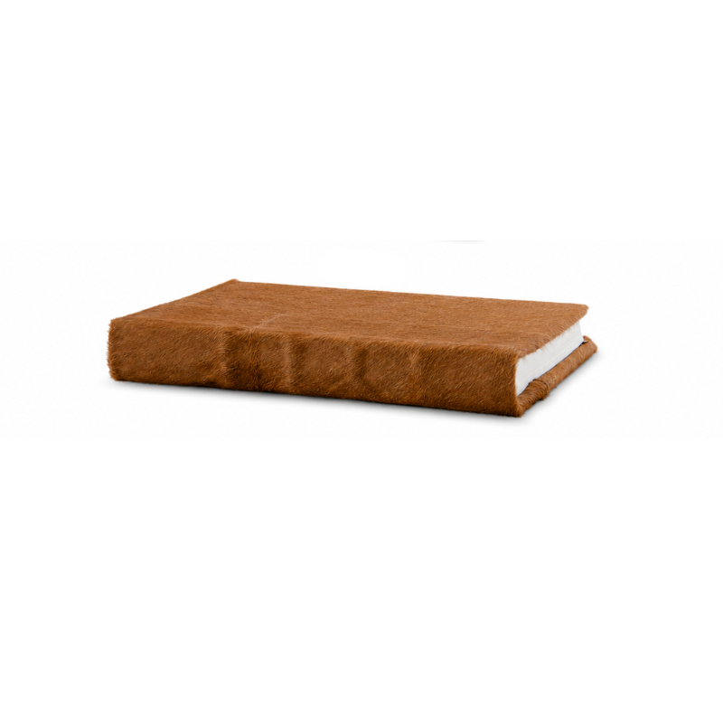 Tan hide journal with a textured brown fur cover and unlined white pages.