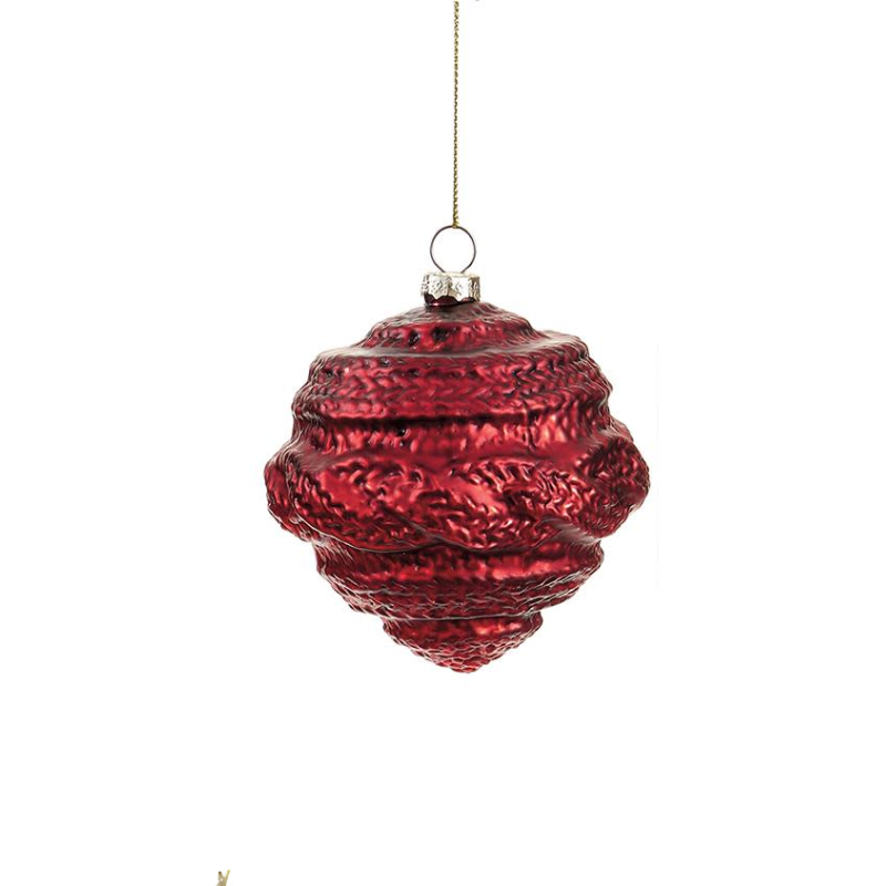Red glass Christmas ornament with a textured, knit-like pattern hanging from a gold string.