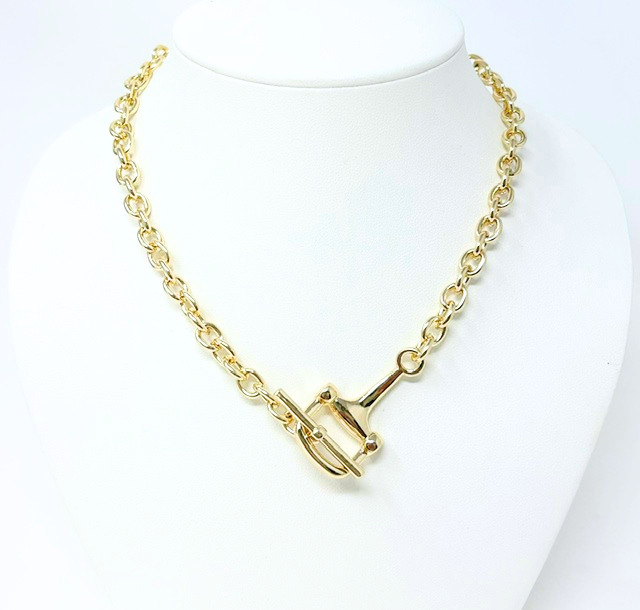 Gold classic rollo chain necklace with a toggle clasp on a white jewelry bust.