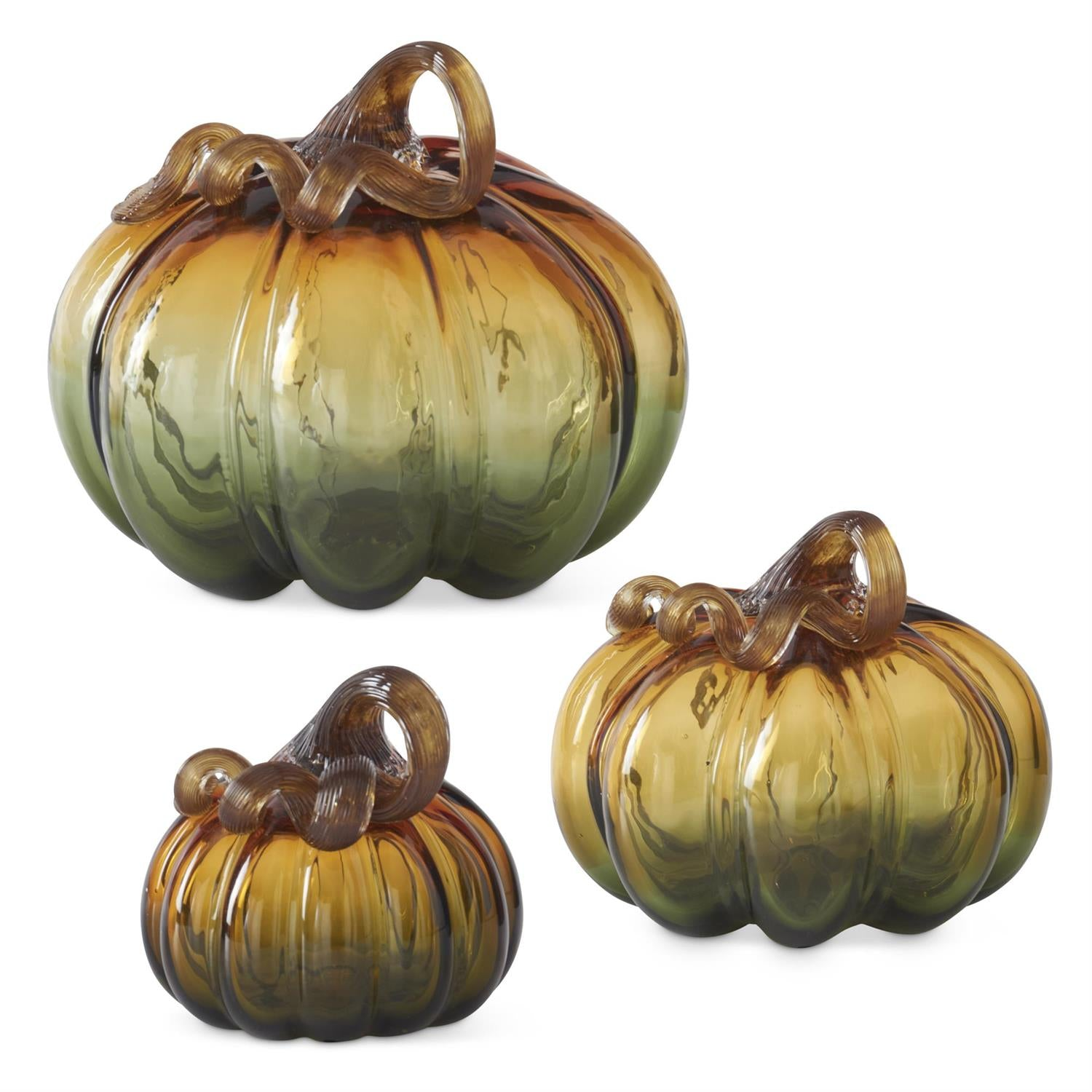 Three handblown glass pumpkins in varying sizes with a green and amber gradient and curled stems.
