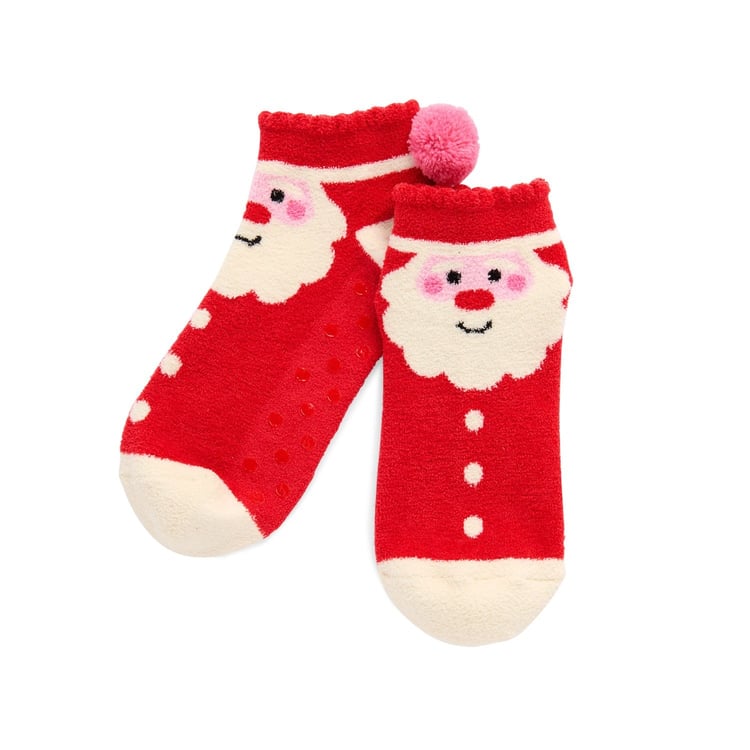A pair of red and white fuzzy Santa Claus socks with a pink pom pom and non-slip grips.