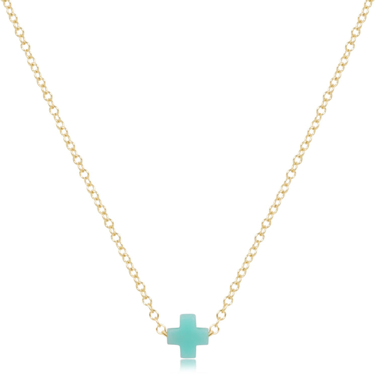 16-inch 14kt gold-filled chain necklace featuring a small turquoise-colored signature cross pendant.