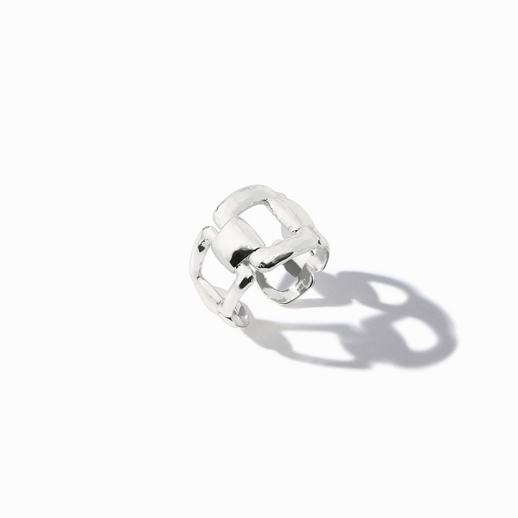 Sahara Ring Silver, a wide sterling silver band with an open, interlocking geometric design.