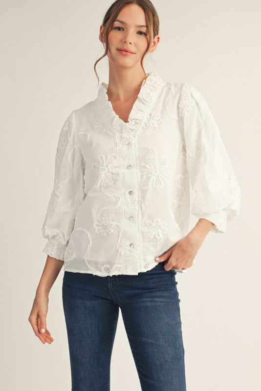 Madeline button-down top in white cotton with a three-dimensional floral pattern.