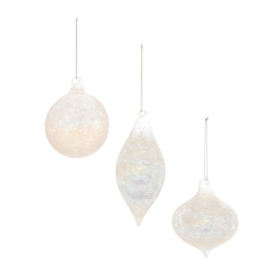 Set of three white iridescent glass ornaments in round, teardrop, and onion shapes.