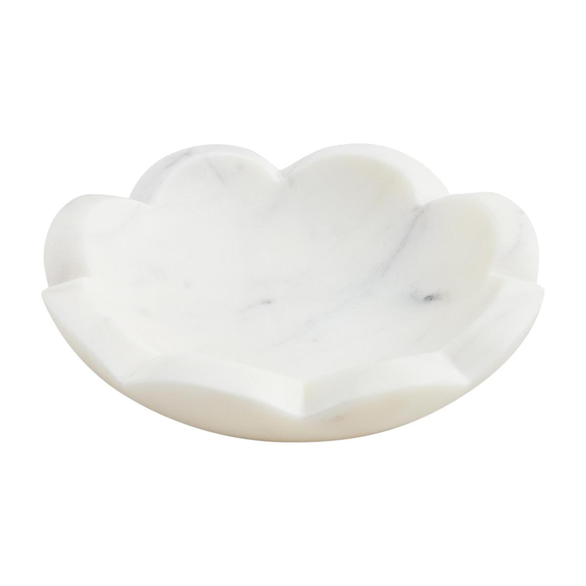 Round scallop marble dish with a natural stone pattern.