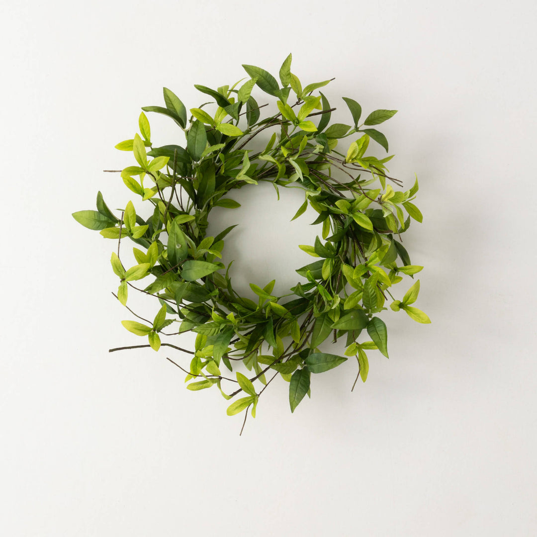Green polyester ring wreath with ruscus leaves and twigs