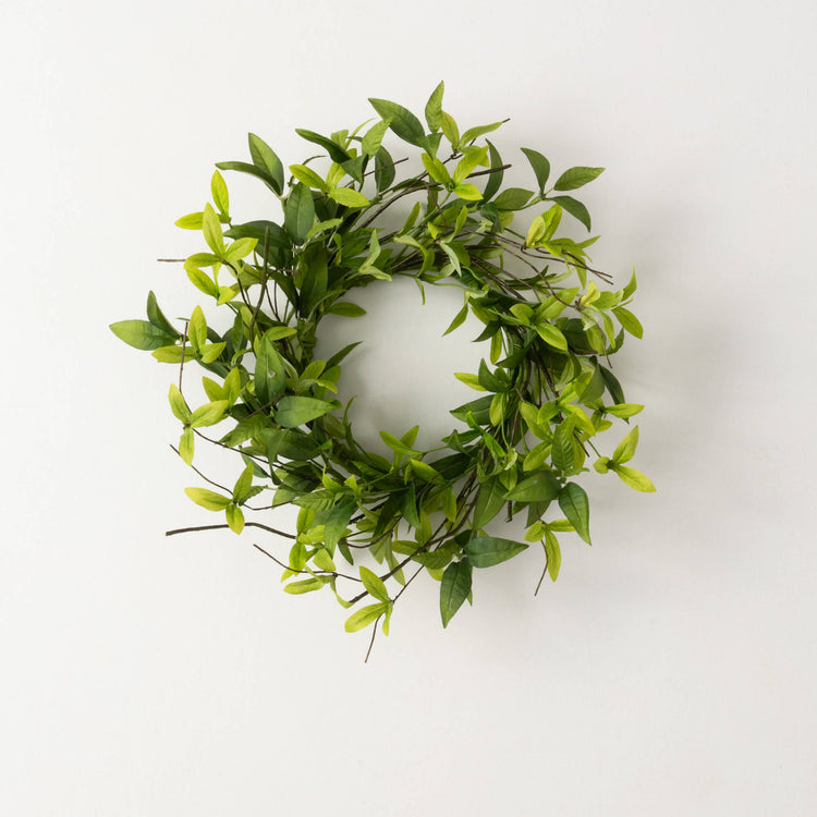 Green polyester ring wreath with ruscus leaves and twigs