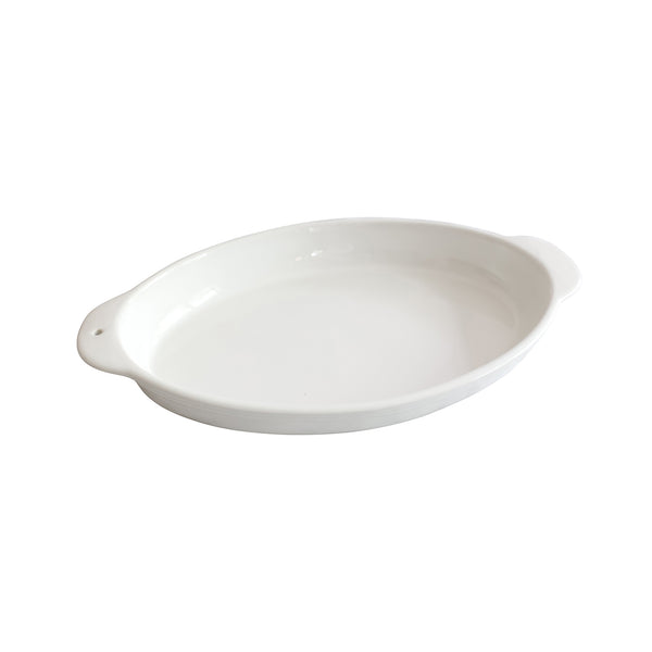 White oval ceramic baker with side handles and subtle pinstripe texture on the exterior.