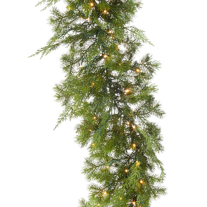 Green mixed cedar and pine garland with warm white snake lights