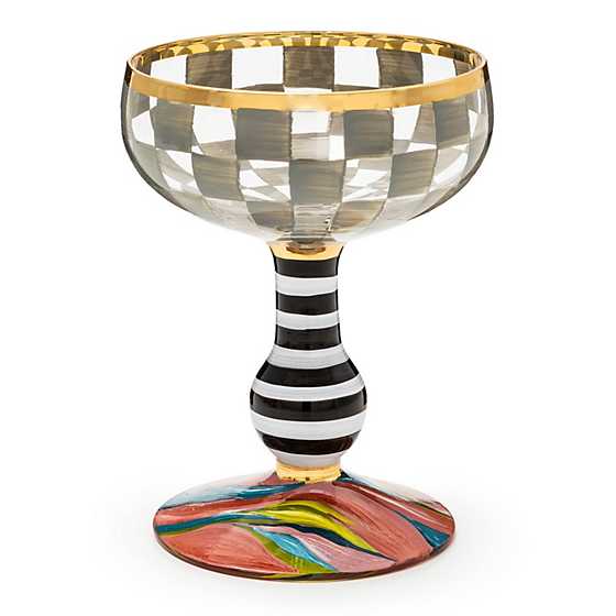 Hand-blown Carnival Coupe glass with colorful swirls in clear material.