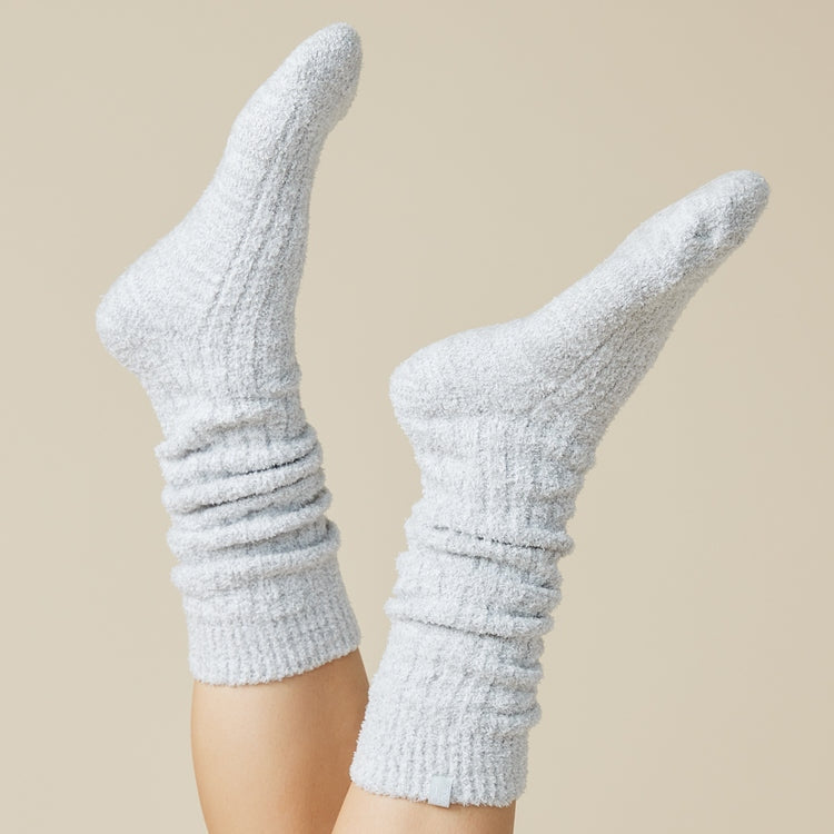 Slouchy marshmallow socks in heathered gray with non-slip grippers on the sole.