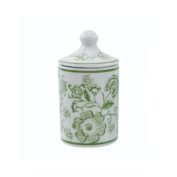 Hand-stamped white stoneware spice jar with green floral patterns and a matching lid.