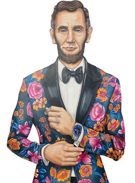 Abraham Lincoln wearing a floral print suit with a bow tie and watch.