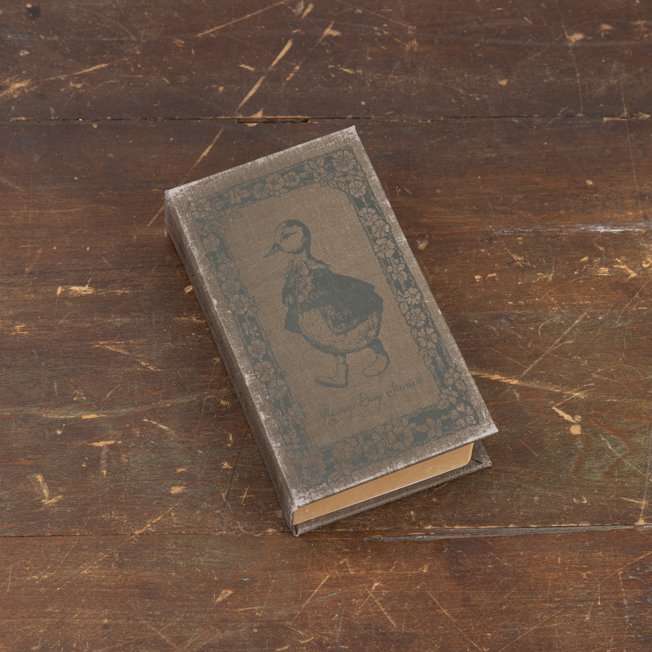 7-inch wooden journal with paper pages titled Rainy Day Stories