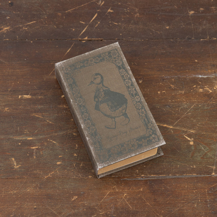 7-inch wooden journal with paper pages titled Rainy Day Stories