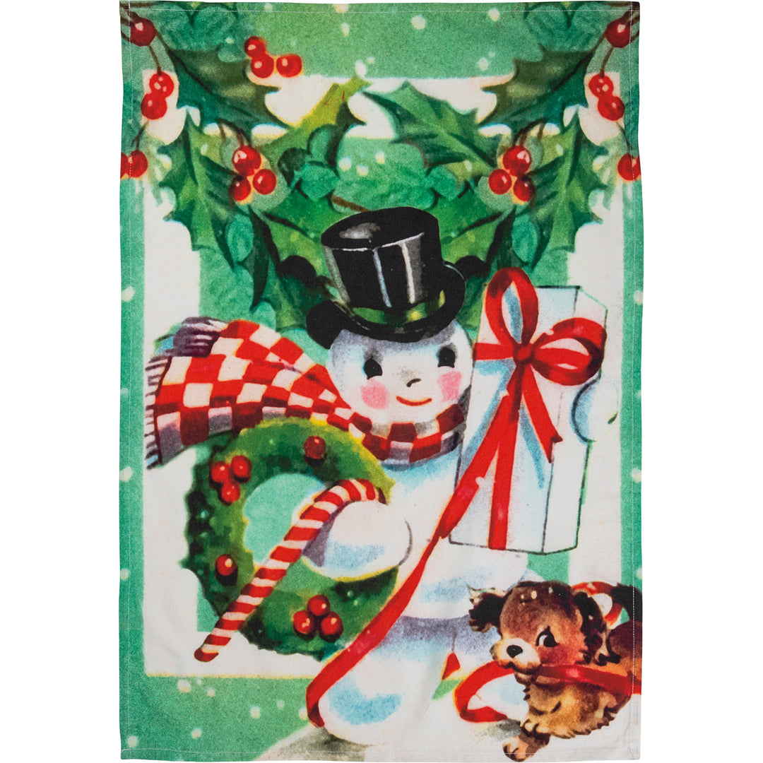Holiday dish towel featuring a vintage-style snowman with a top hat, scarf, and gift, next to a puppy and a wreath.