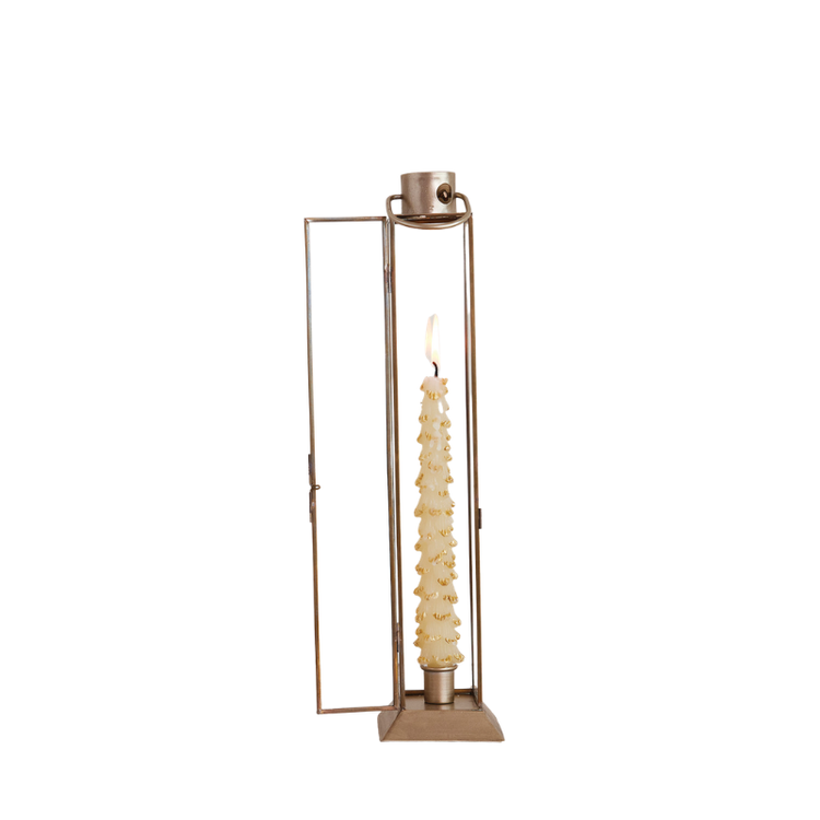 Large gold finish metal and glass lantern taper holder with a lit decorative candle inside.
