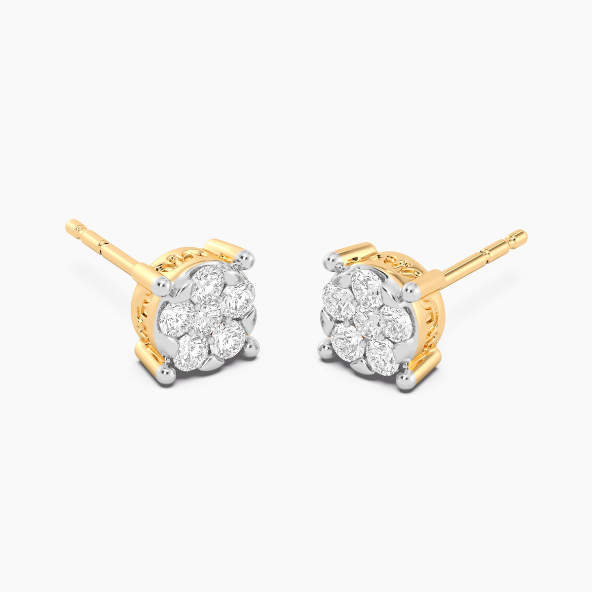 Gold lab-grown diamond four-prong stud earrings with a round brilliant cut stone.