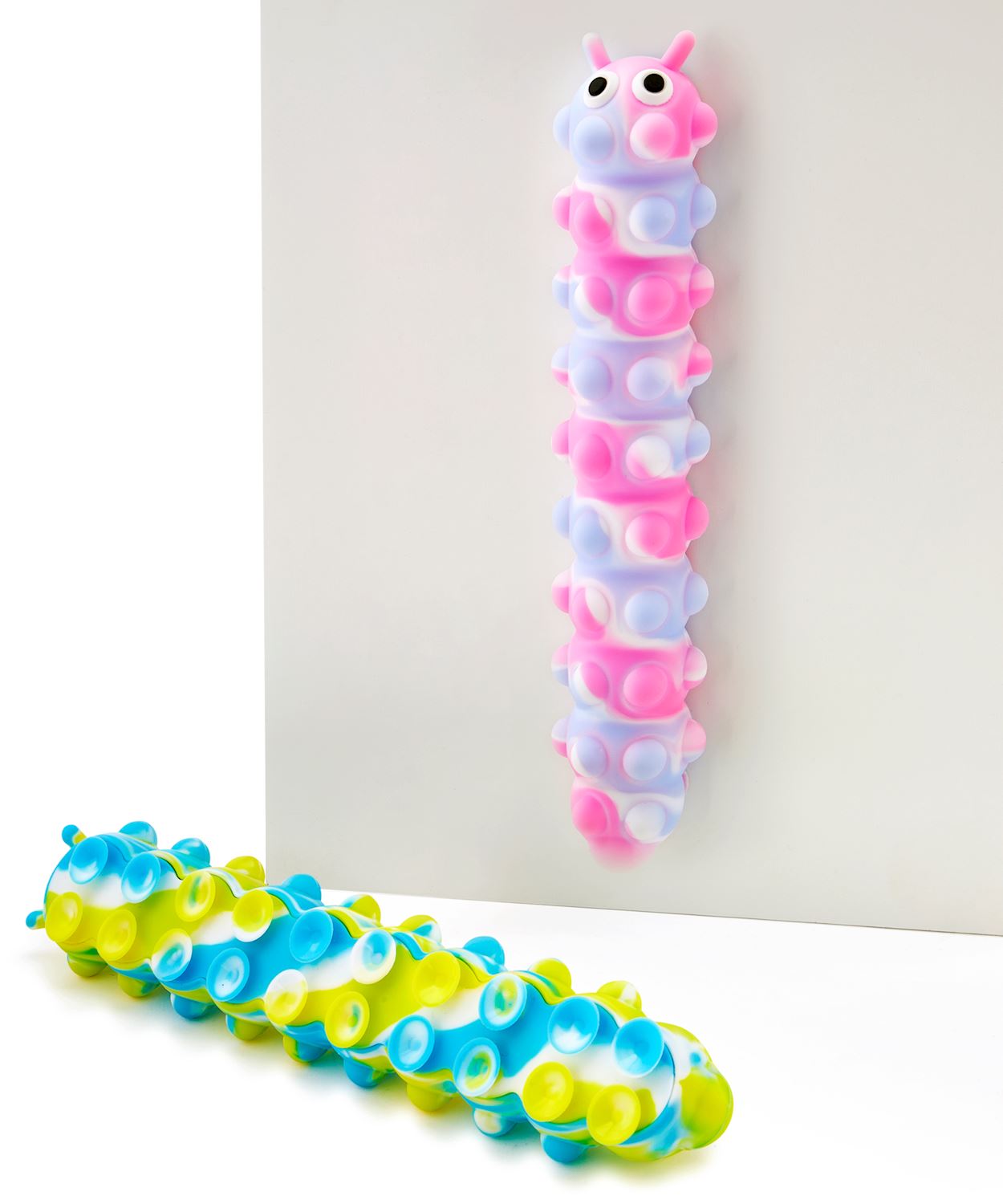 Silica gel pop it caterpillar fidget toy in green with black segmented body and yellow accents.