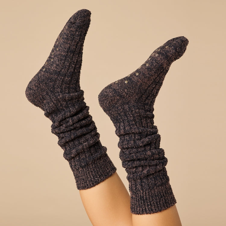 Slouchy marshmallow socks in heathered gray with non-slip grippers on the sole.
