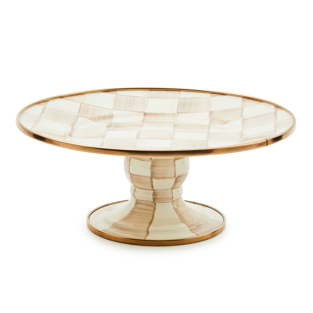 Mocha Check Mini Pedestal Platter with hand-painted checks and bronzed stainless steel rim.