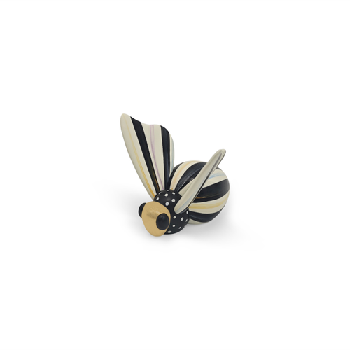 Decorative bee figurine with black and white stripes, polka dots, and gold-tone accents.