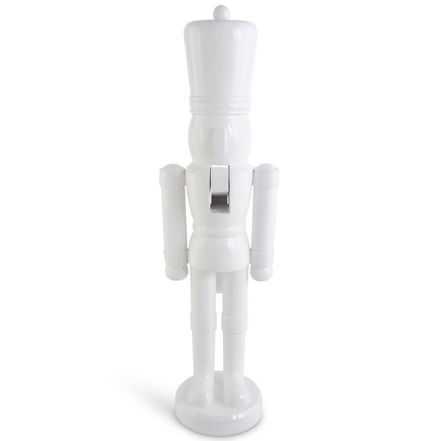 55.5 inch tall white resin nutcracker soldier statue on a round base.