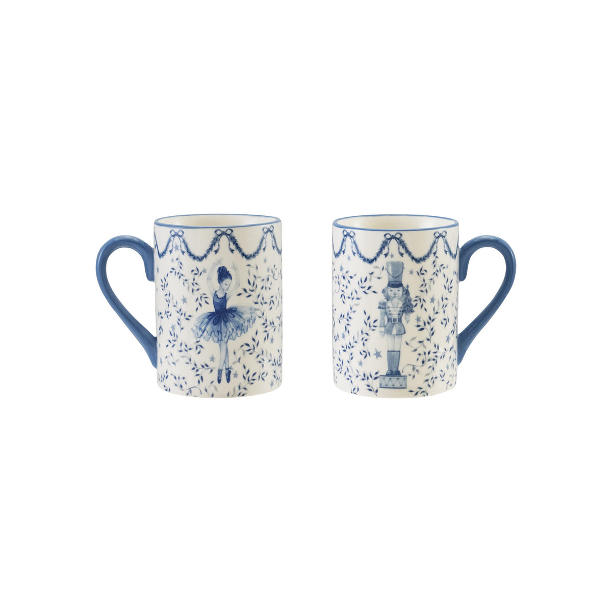 Two 12 oz. white ceramic mugs with blue ballerina and nutcracker designs and blue handles.