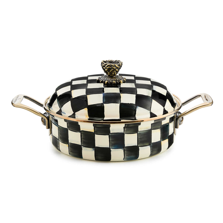 Courtly Check enamel 3 quart casserole with black and white hand-painted pattern and brass handles.