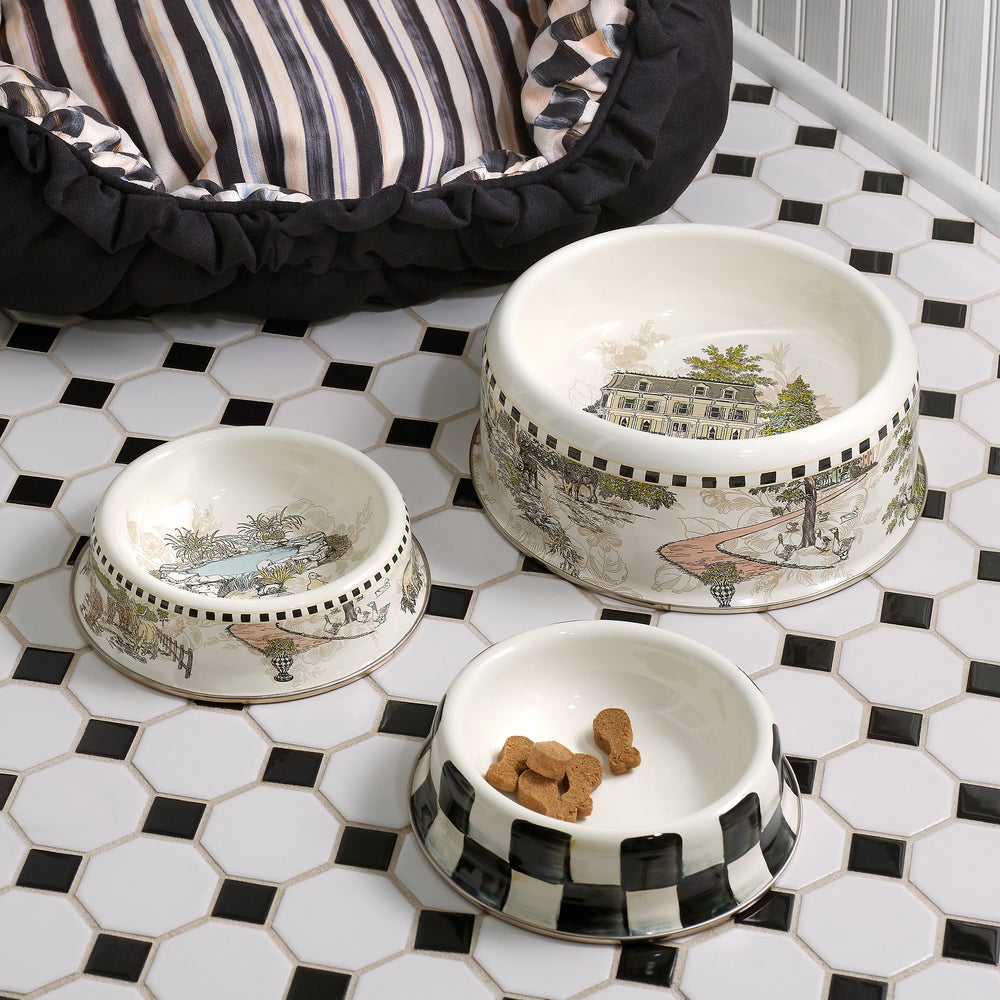 Small Courtly Check pet dish with hand-painted blue floral pattern on steel base and bronzed stainless rim.