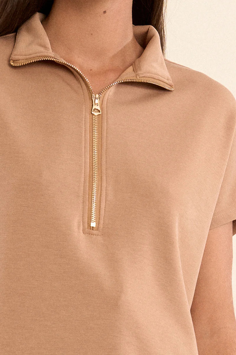 Close-up of a tan Cassey Ladies Knitted Sleeveless Sweat featuring a gold quarter-zip and collar.