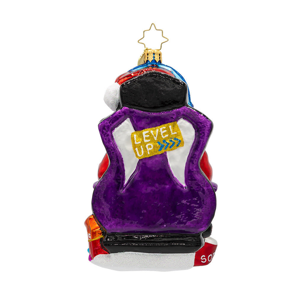 Game Master Santa ornament: a red gamer-themed Christmas tree decoration featuring a joystick-wielding Santa in turbo sleigh silhouette.