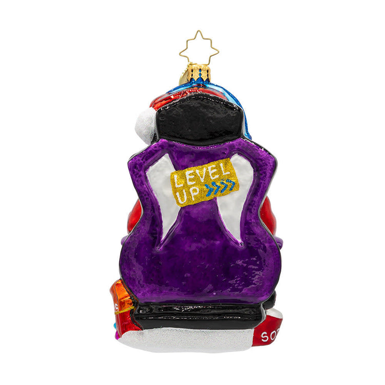 Game Master Santa ornament: a red gamer-themed Christmas tree decoration featuring a joystick-wielding Santa in turbo sleigh silhouette.