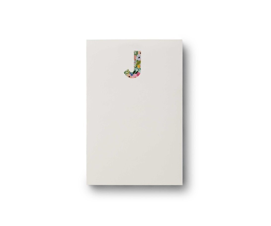 Garden Party monogram notepad with floral botanical illustrations in green tones.