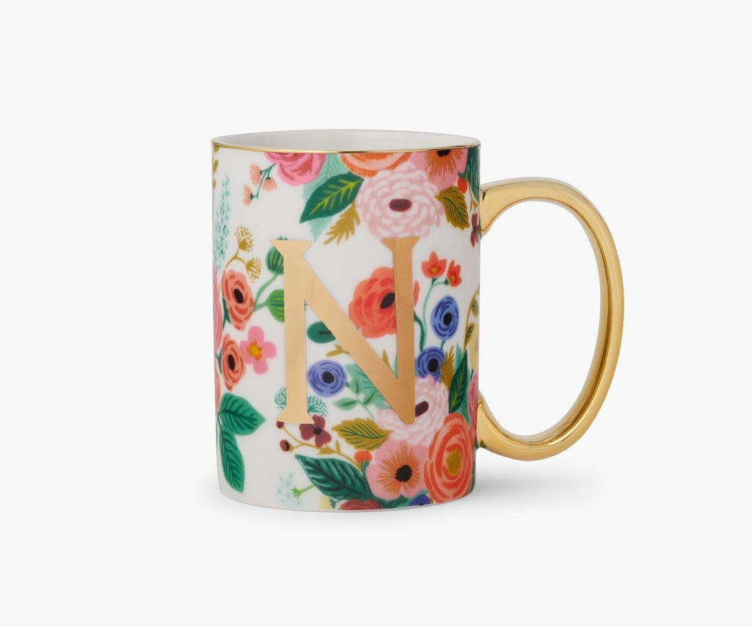 White porcelain mug with Garden Party floral illustration, gold foil monogram, gilded rim and handle.