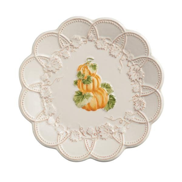 Stacked Gather salad plates in stoneware with a scalloped edge.