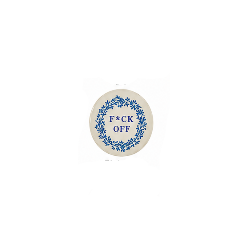 Round hand-painted stoneware magnet with a blue floral wreath and the text "F*CK OFF".