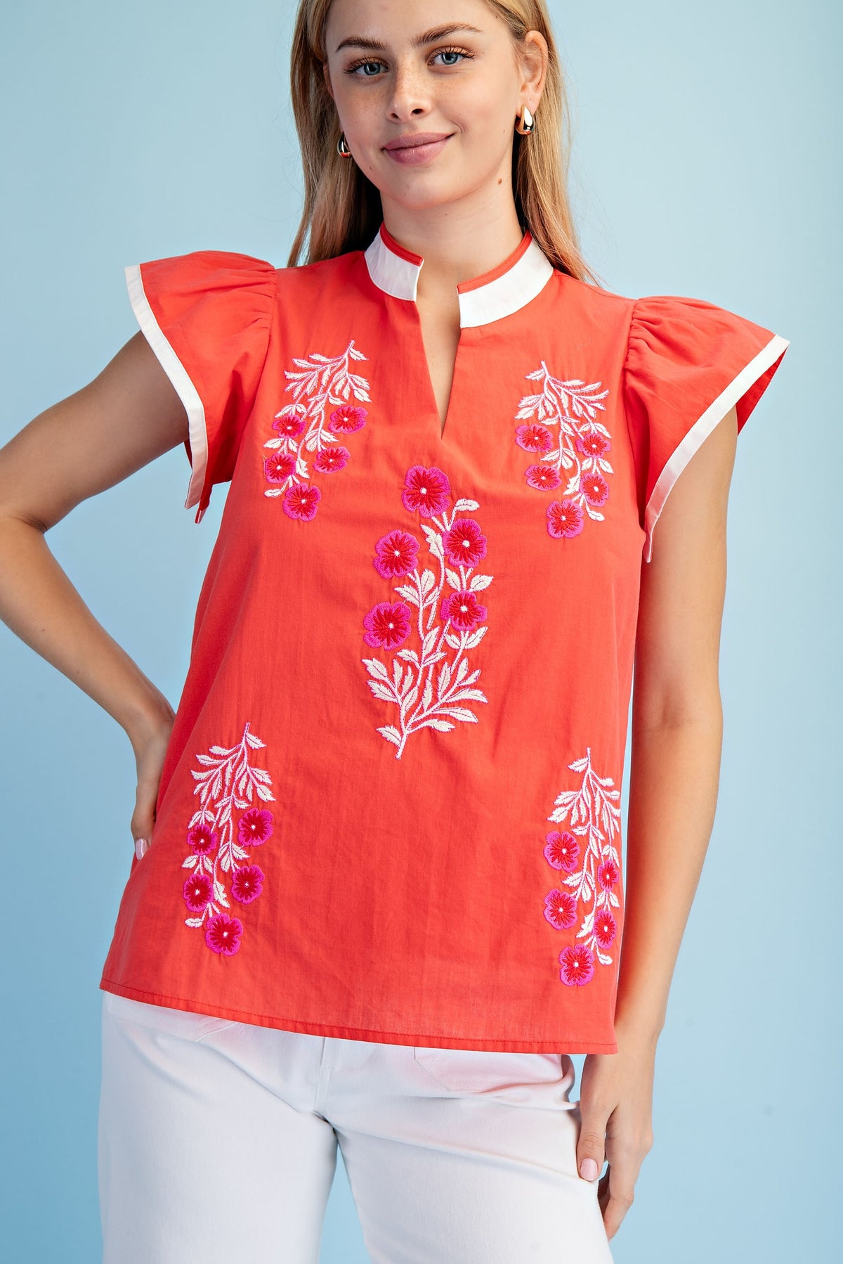 Floral embroidered cotton V-neck top with contrasting stripe trim on flutter sleeves.